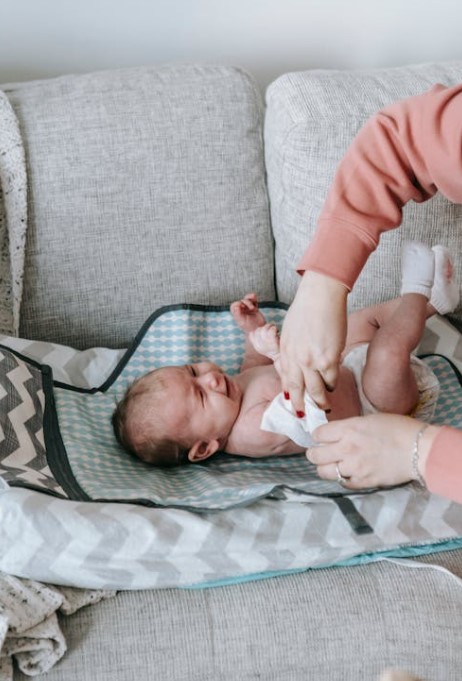 changing diaper in living room